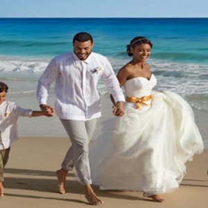 Beach Weddings Abroad Dominican Republic Weddings Bride And Groom Running On Beach1