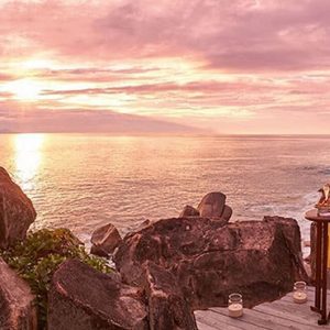 Beach Weddings Abroad Seychelles Weddings Couple Watching The Sunset With A Glass Of Champagne