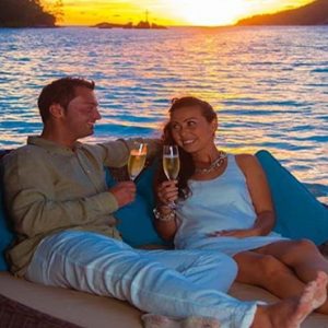 Beach Weddings Abroad Seychelles Weddings Couple Relaxing With Champagne