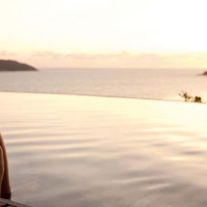 Beach Weddings Abroad Seychelles Weddings Woman Sitting By Pool With Champagne